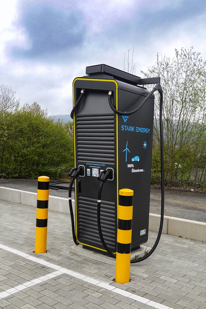 Services A state-of-the-art electric vehicle charging station situated outdoors in a public area.